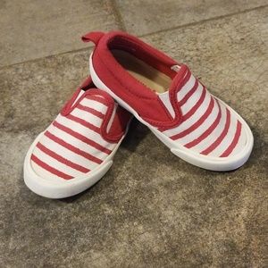 Red and white striped canvas shoes